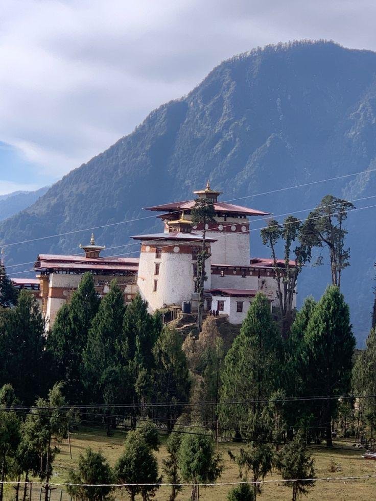 Gasa Dzong below a mountain peak, Bhutan