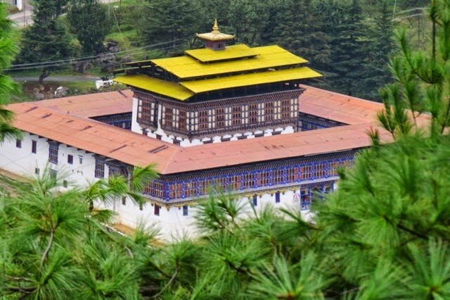 Haa Dzong with its golden roof among pine trees, Bhutan