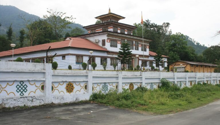 Samtse Dzong behind a decorated white wall, Bhutan