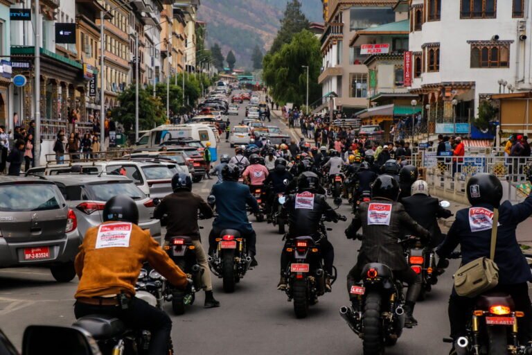 Motorcycle group riding through Thimphu, Bhutan